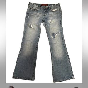 Vintage low rise flare light wash distressed denim jeans from brand YMI jeans